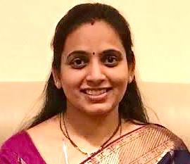 A person smiling for the camera

Description automatically generated